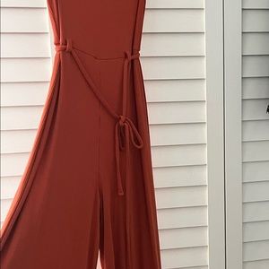 Burnt orange ribbed jumpsuit.